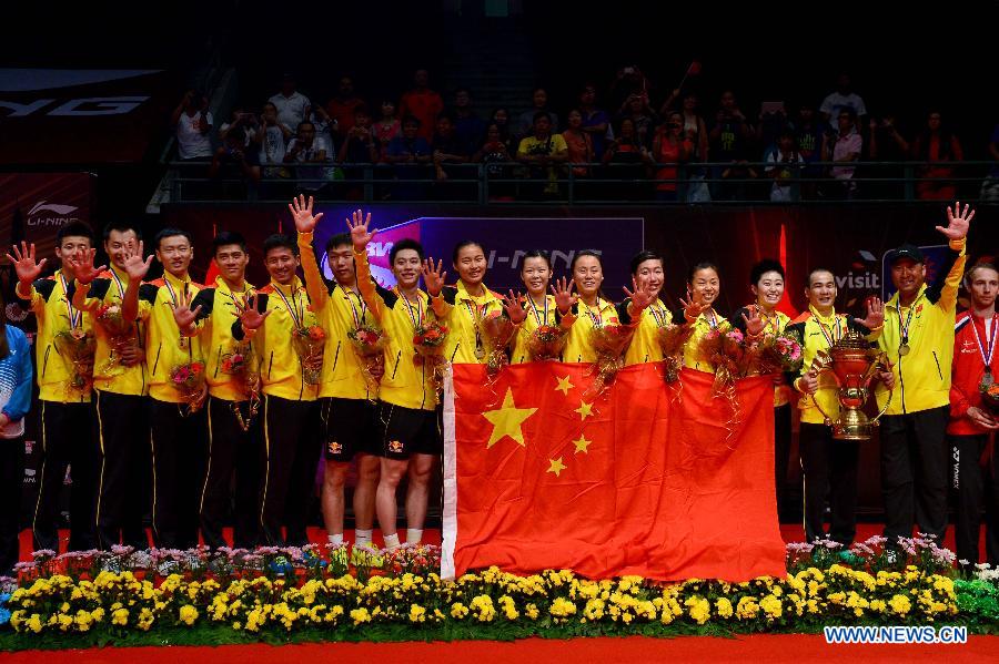 Players of China pose with the trophy after the final match against South Korea at the Sudirman Cup World Team Badminton Championships in Kuala Lumpur, Malaysia, on May 26, 2013. Team China won the champion with 3-0. (Xinhua/Chong Voon Chung)