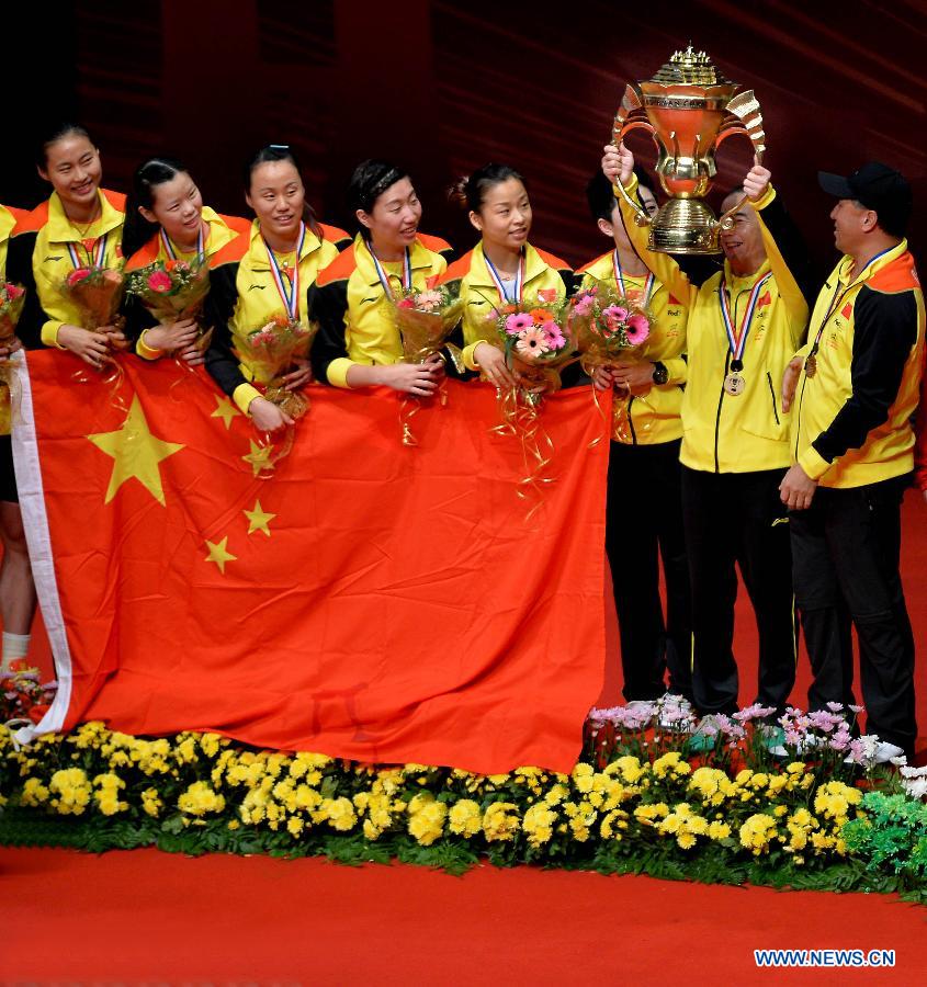 Players of China celebrate during the awarding ceremony after the final match against South Korea at the Sudirman Cup World Team Badminton Championships in Kuala Lumpur, Malaysia, on May 26, 2013. Team China won the champion with 3-0. (Xinhua/Chen Xiaowei)