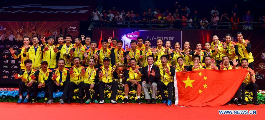 Players of China pose with the trophy after the final match against South Korea at the Sudirman Cup World Team Badminton Championships in Kuala Lumpur, Malaysia, on May 26, 2013. Team China won the champion with 3-0. (Xinhua/Chong Voon Chung)
