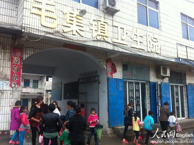 Parents accompany their children, who were victims of sexual assaults by their teacher at a primary school at Douchengou village, Huanggang town of Tongbai county in Nanyang city in Central China's Henan province, to receive medical re-evaluations at a health center in Maoji county on May 25, 2013. According to the medical results from Friday, nine of the 16 female students had their hymens broken while it was also discovered that other students had received some sort of physical harm from their teacher.