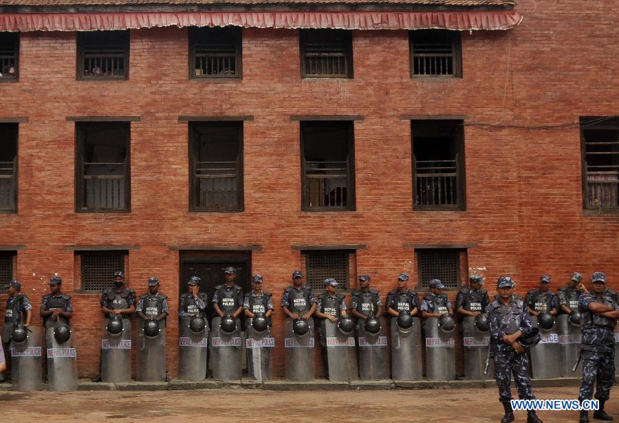 Nepali policemen stand guard during the celebrations to mark the Mt. Qomolangma Diamond Jubilee in Kathmandu, Nepal, May 29, 2013. The families of Edmund Hillary and Sherpa Tenzing Norgay are celebrating on Wednesday the 60th anniversary of the first ascent of Mt. Qomolangma in human history when the two heroes reached the summit. (Xinhua/Sunil Pradhan) 