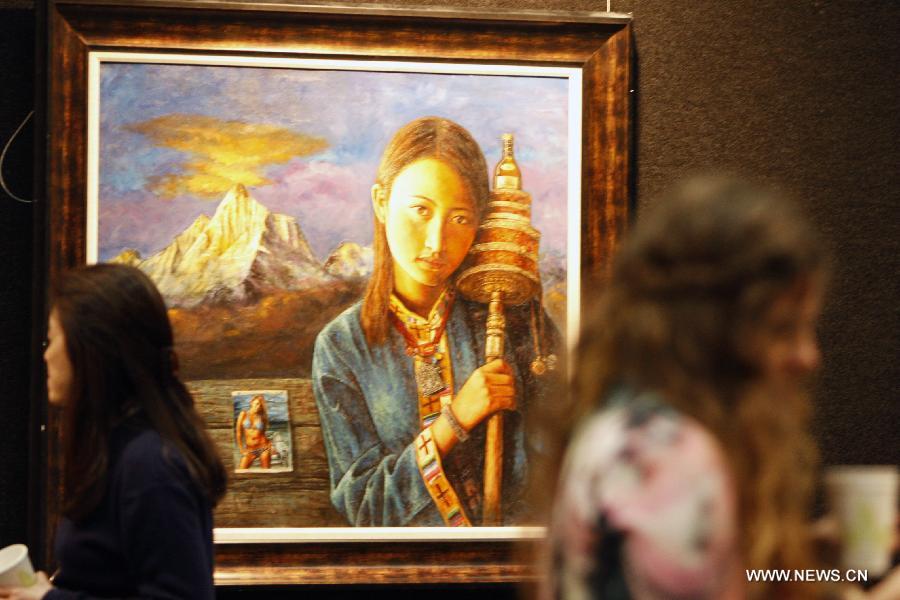 People visit the 2013 "Beauty of Tibet" Painting and Photography exhibition in Sydney, Australia, May 31, 2013. 2013 "Beauty of Tibet" Painting and Photography exhibition in Australia kicked off in Sydney Friday, with a total of 240 works being displayed during the three-day show. (Xinhua/Jin Linpeng)