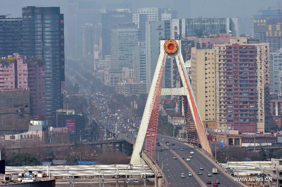 Photo taken on March 5, 2013 shows the Tianfu flyover in Chengdu, capital of southwest China's Sichuan Province. By the end of 2012, Chengdu's GDP has reached 800 billion RMB (about 130.48 billion U.S. dollars), ranking the 3rd place in China's sub-provincial cities. By May of 2013, more than 230 enterprises in the Fortune 500 have come to Chengdu. The 2013 Fortune Global Forum will be held in Chengdu from June 6 to June 8. Chengdu, an ancient city with a history of over 2,300 year, is developing into an international metropolis with its huge economic development potential as well as its special cultural environment. (Xinhua/Xue Yubin)