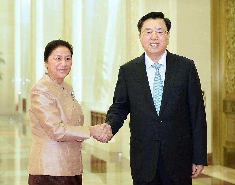 Zhang Dejiang (R), chairman of the Standing Committee of the National People's Congress, shakes hands with Pany Yathotou, president of the Laotian National Assembly, in Beijing, capital of China, June 3, 2013. Zhang held talks with Pany Yathotou here on Monday. (Xinhua/Li Tao)