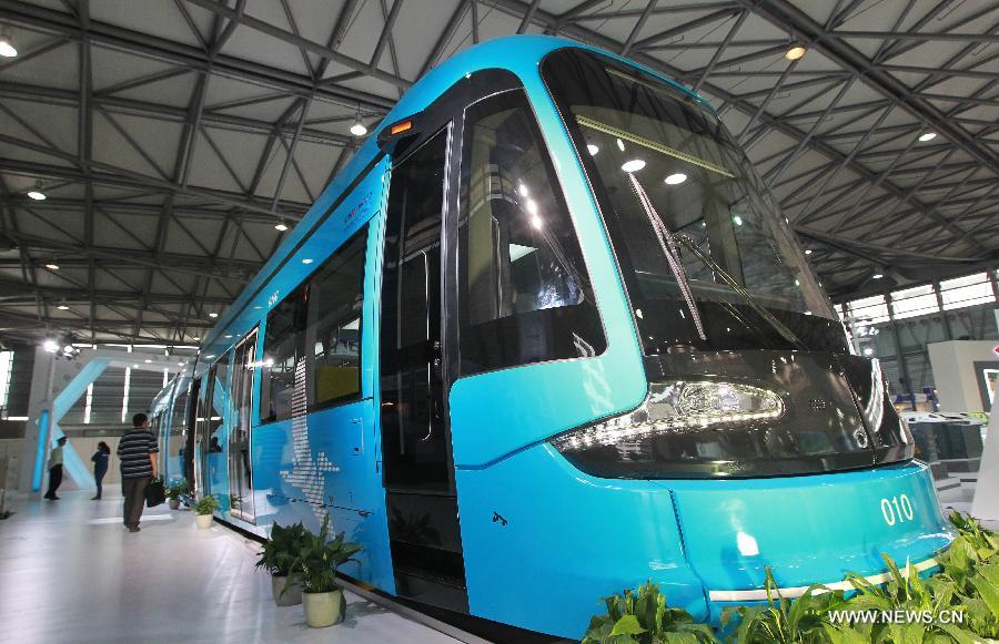 A tramcar made by Changchun Railway Vehicles Company is displayed on the exhibition "Rail + Metro China 2013" in Shanghai, east China, June 4, 2013. The exhibition, showcasing metro and rail-related technologies and products worldwide, kicked off here Tuesday. (Xinhua/Pei Xin)