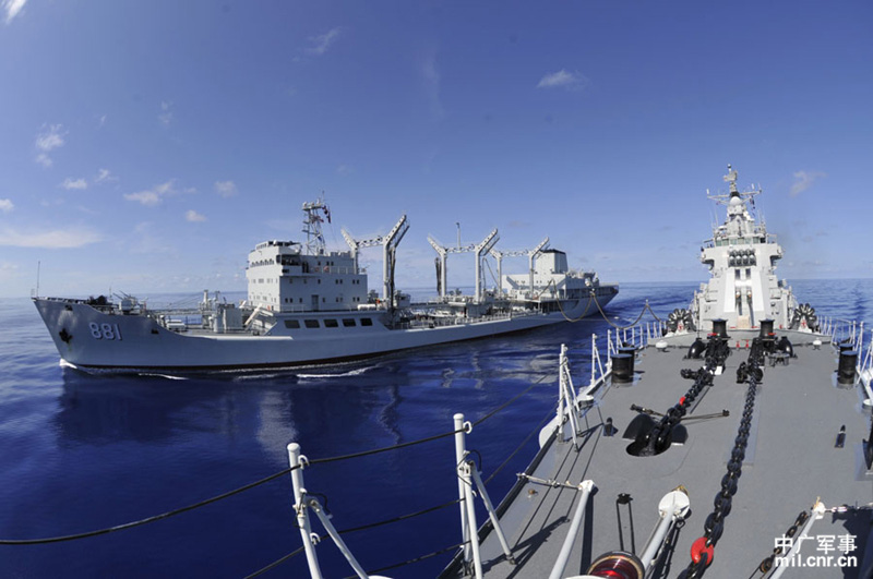 The high-sea training taskforce under the North China Sea Fleet of the Navy of the Chinese People's Liberation Army (PLAN) conducted comprehensive replenishment training in a sea area of the Western Pacific Ocean on June 1, 2013. It is the first time for the guided missile frigate "Linyi" to complete its replenishment during sailing since it was commissioned late last year. (mil.cnr.cn/Chen Zhong, Kong Xianglong and Zhang Gang)