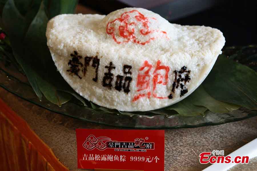 A luxury zongzi priced at 9,999 yuan (US$1,620) is displayed in a restaurant in Taiyuan, capital of Shanxi Province, June 6, 2013. The zongzi is made of sticky rice with rare stuffing, including abalone, black truffles and jamón. Zongzi has been a traditional food in China for a long time at Duanwu Festival, the fifth of May on Chinese lunar calendar which fall on June 12 this year. (CNS/Zhang Yun)
