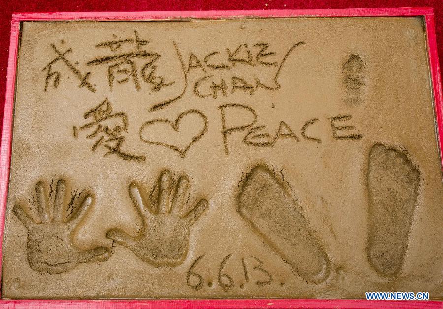 Actor Jackie Chan's hand and footprints are seen following a ceremony at the TCL Chinese Theatre in Hollywood, California, the United States, on June 6, 2013. (Xinhua/Zhao Hanrong) 