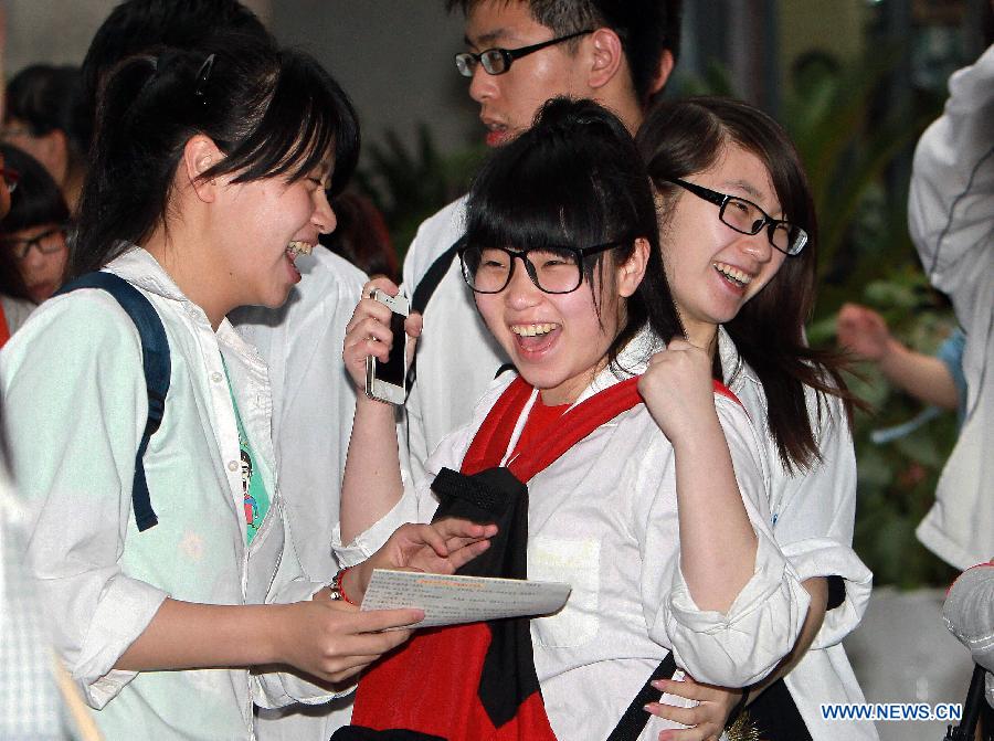 Students celebrate after the college entrance examination in the No. 54 Middle School in east China's Shanghai, June 8, 2013. The 2013 national college entrance examination ended in some regions of China on Saturday. Approximately 9.12 million people took part in the exam this year. (Xinhua/Ding Ting)