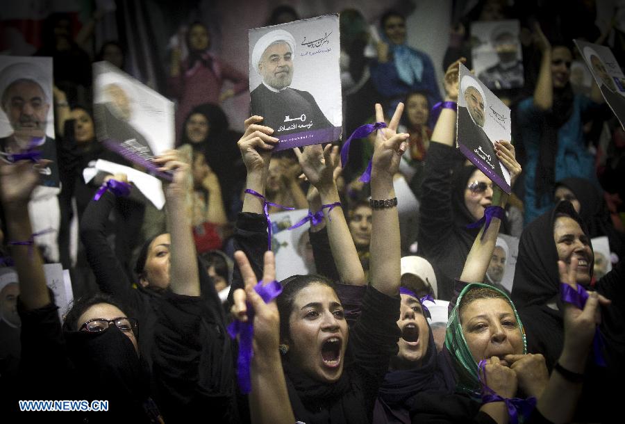 Supporters shout slogans during a campaign rally of Iran's moderate presidential candidate Hassan Rouhani, in downtown Tehran, capital of Iran, on June 8, 2013. (Xinhua/Ahmad Halabisaz) 