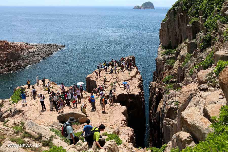 Tourists visit the North Ninepin Island in Hong Kong, south China, June 9, 2013. The Ninepin Group, or Kwo Chau Islands, is a group of islands in the southeastern Hong Kong. (Xinhua/Li Peng) 