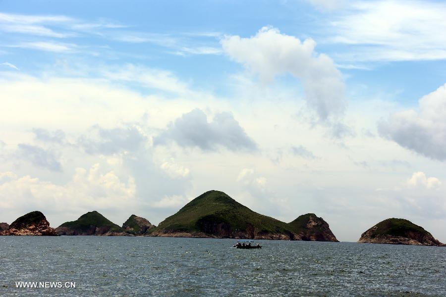 A boat is seen on the waters off the Ninepin Island in Hong Kong, south China, June 9, 2013. The Ninepin Group, or Kwo Chau Islands, is a group of islands in the southeastern Hong Kong. (Xinhua/Li Peng) 