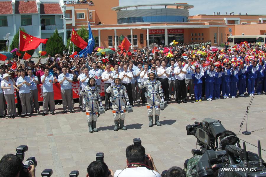 Astronauts Nie Haisheng (R), Zhang Xiaoguang (C) and Wang Yaping attend the setting-out ceremony of the manned Shenzhou-10 mission at the Jiuquan Satellite Launch Center in Jiuquan, northwest China's Gansu Province, June 11, 2013. (Xinhua/Li Peibin) 