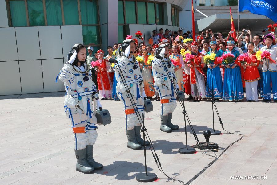 Astronauts Nie Haisheng (C), Zhang Xiaoguang (R) and Wang Yaping attend the setting-out ceremony of the manned Shenzhou-10 mission at the Jiuquan Satellite Launch Center in Jiuquan, northwest China's Gansu Province, June 11, 2013. (Xinhua/Li Gang) 