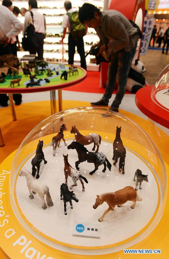 Animal figures are displayed at the annual International Tokyo Toy Show on June 13, 2013. The International Toy Show kicked off here on Thursday. (Xinhua/Ma Ping) 
