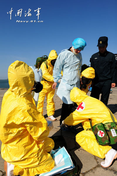 China's first maritime NBC emergency rescue team under a submarine base of the North Sea Fleet of Chinese navy conducts training in a sea area. The training subjects included real-time monitoring, sample collection and analysis and contaminated areas delineation. (China Military Online/Yu Hang, Yu Haitao)
