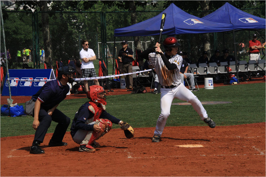 A player for the MLB College All-Star Team bats against the MLB Development Center (AAA) Team on June 12, 2013, at Tsinghua University as part of the MLB University Cup event. (CRIENGLISH.com/Stuart Wiggin)  