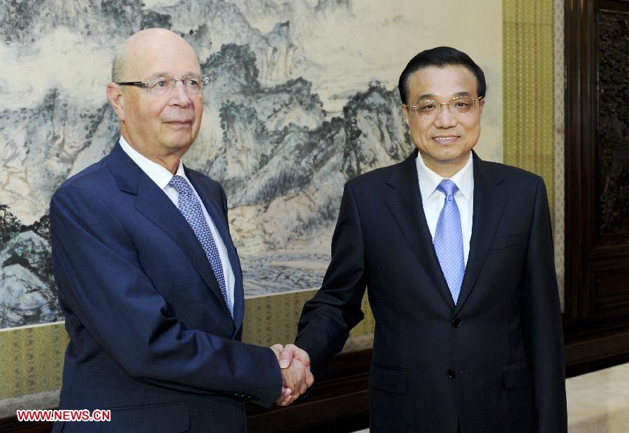 Chinese Premier Li Keqiang (R) meets with World Economic Forum (WEF) Chairman Klaus Schwab in Beijing, capital of China, June 14, 2013. (Xinhua/Zhang Duo) 