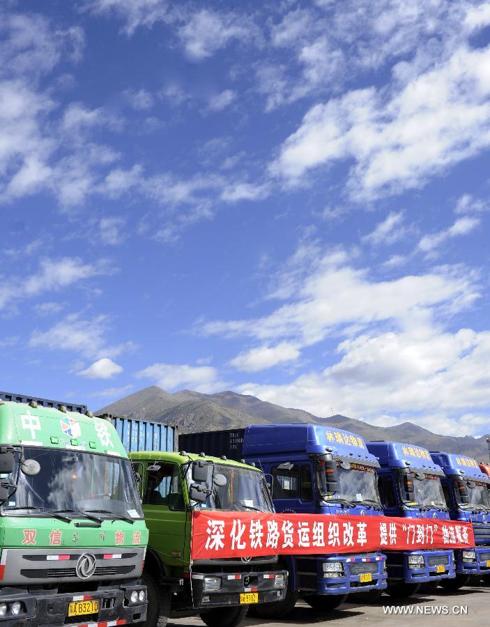 Trucks park at the Lhasa West Railway Station in Lhasa, capital of southwest China's Tibet Autonomous Region, June 15, 2013. The China Railway Corporation, a commercial arm separated from the nation's ex-railways ministry, said Saturday that it will push its freight transport services to cover a bigger market. A company spokesman said it will work toward that goal through a slew of reforms focused on efficiency and better services, in efforts to transform the company's freight transport into a modern logistics business. (Xinhua/Chogo) 