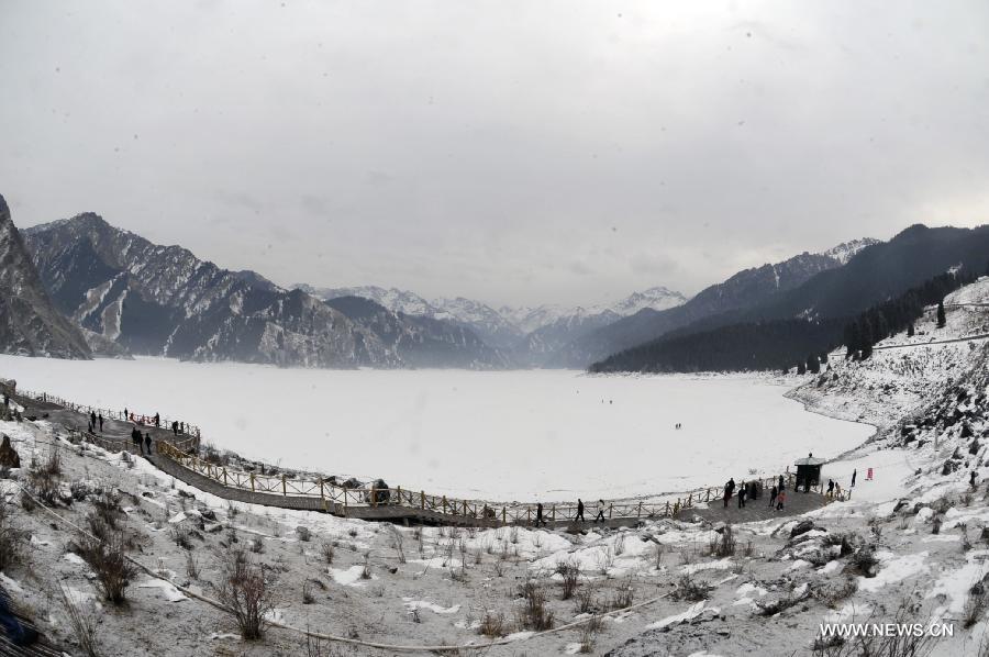 Photo taken on Dec. 31, 2011 shows the scenery of the Tianchi lake on the Tianshan in northwest China's Xinjiang Uygur Autonomous Region. The 37th session of UNESCO's World Heritage Committee (WHC) inscribed China's Xinjiang Tianshan on the World Heritage List as a natural site on June 21, 2013. Xinjiang Tianshan is a serial property totaling 606,833 hectares and consisting of four components which are located along the 1,760 km Tianshan range, a temperate arid zone surrounded by Central Asian deserts.(Xinhua/Zhao Ge) 