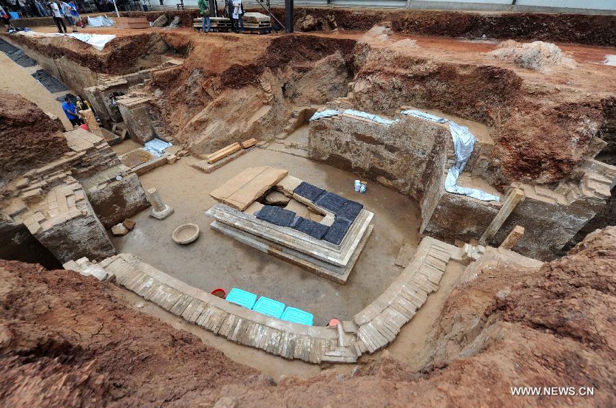Photo taken on June 22, 2013 shows the archeological site of an ancient tomb in Fangshan District of Beijing, capital of China. A gravestone excavated from the tomb confirmed that the tomb was the final resting place of Liu Ji, a regional military governor of the Tang Dynasty (618-907), and his wife. Archaeologists have started a salvage excavation of the tumulus since August 2012, after it was accidentally discovered at a local construction site. Valuable cultural relics, including an exquisite stone coffin bed, were discovered. (Xinhua/Luo Xiaoguang) 