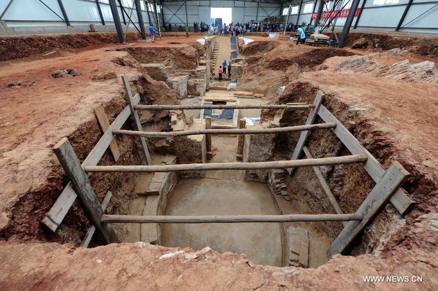 Photo taken on June 22, 2013 shows the archeological site of an ancient tomb in Fangshan District of Beijing, capital of China. A gravestone excavated from the tomb confirmed that the tomb was the final resting place of Liu Ji, a regional military governor of the Tang Dynasty (618-907), and his wife. Archaeologists have started a salvage excavation of the tumulus since August 2012, after it was accidentally discovered at a local construction site. Valuable cultural relics, including an exquisite stone coffin bed, were discovered. (Xinhua/Luo Xiaoguang)