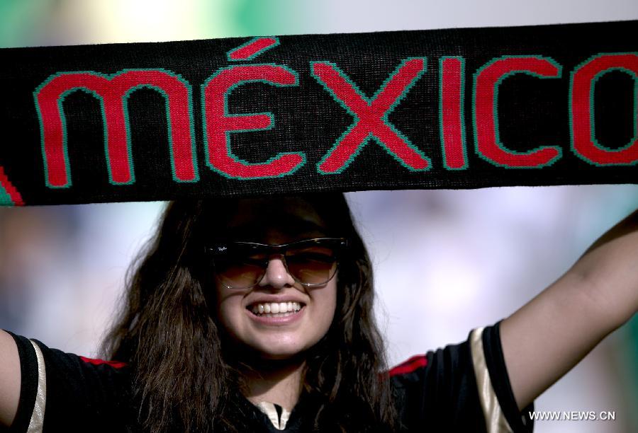 A fan of Mexico reacts prior to the FIFA's Confederations Cup Brazil 2013 match against Japan held at Mineirao Stadium in Belo Horizonte, Minas Gerais state, Brazil, on June 22, 2013. (Xinhua/Bao Feifei)