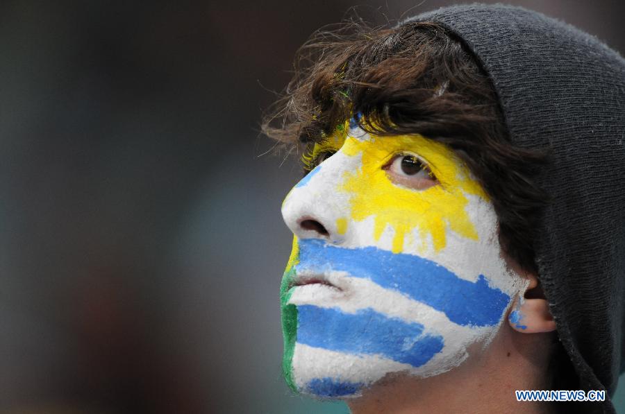 A fan of Uruguay reacts prior to the FIFA's Confederations Cup Brazil 2013 match between Uruguay and Nigeria in Salvador, Brazil, on June 20, 2013. Uruguay won 2-1. (Xinhua/Nicolas Celaya)