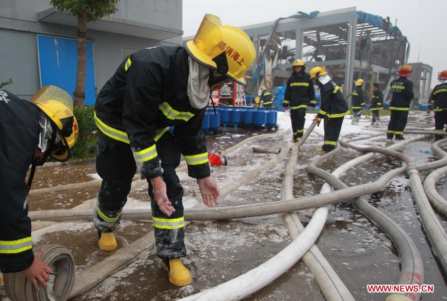 Fire fighters work to put out a fire caused by an explosion at a chemical plant in the Jinshan district of east China's Shanghai, June 24, 2013. Six people were injured in the accident at about 2:15 p.m. The fire has been extinguished as of 3:30 p.m..(Xinhua/Ding Ting) 