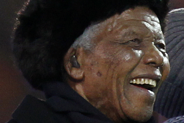 Former South African President Nelson Mandela smiles at Soccer City stadium during the closing ceremony for the 2010 World Cup in Johannesburg July 11, 2010. (Xinhua/Reuters File Photo)