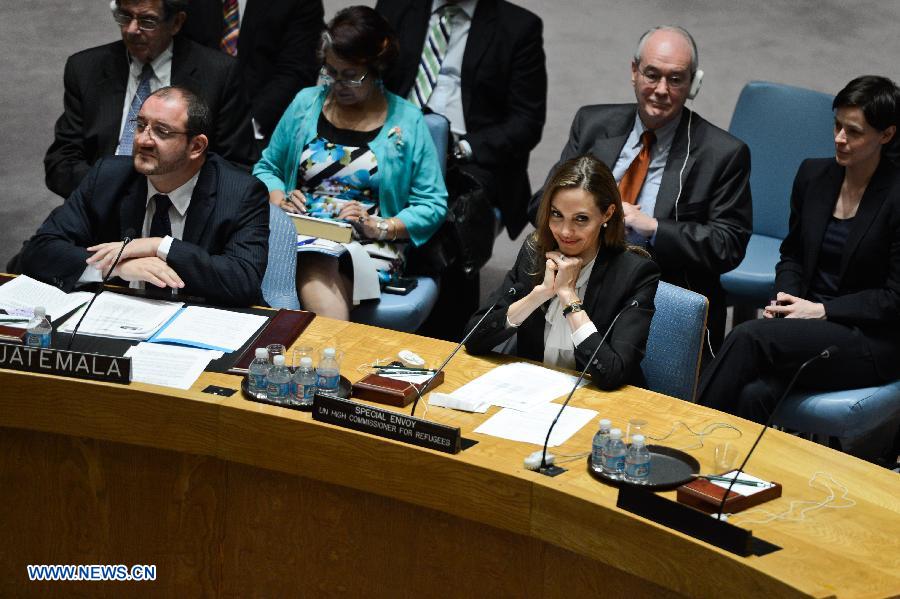 Actress Angelina Jolie (front R), the Special Envoy of the United Nations High Commissioner for Refugees (UNHCR), attends a UN Security Council meeting at the UN headquarters in New York, on June 24, 2013. Jolie on Monday urged the UN Security Council to tackle sexual violence in war zones, promoting strong actions from the international community on this issue. (Xinhua/Niu Xiaolei)