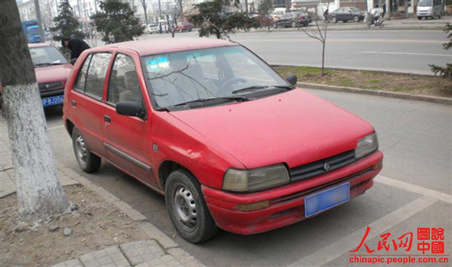 Xiali taxi, is the main type of taxi cab in Beijing in 1990s. No air condition installed is a big problem of the Xiali car. (File Photo) 