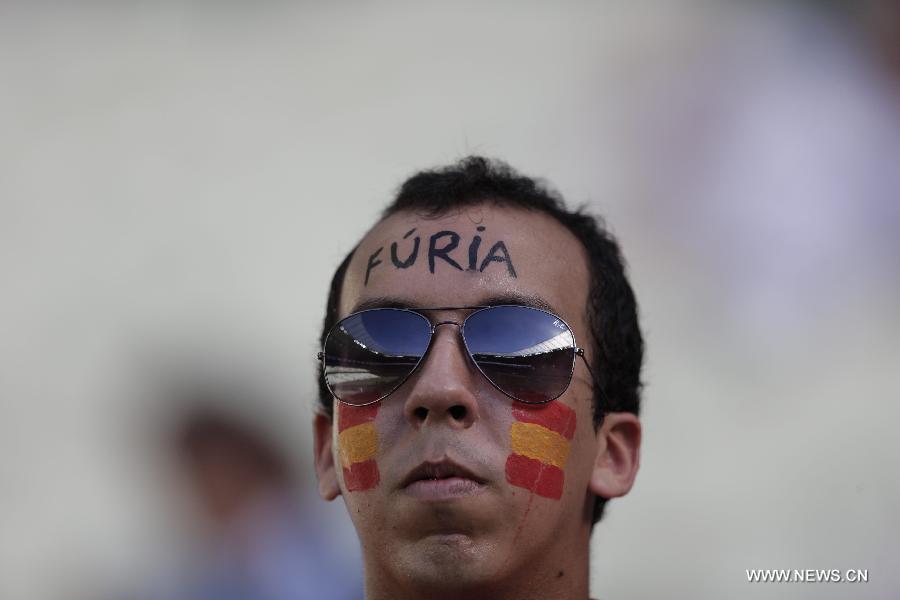 A fan of Spain reacts prior to the FIFA's Confederations Cup Brazil 2013 semifinal match against Italy held at Castelao Stadium in Fortaleza, Brazil, on June 27, 2013. Spain won 7-6 in a penalty shoot-out. (Xinhua/Guillermo Arias)