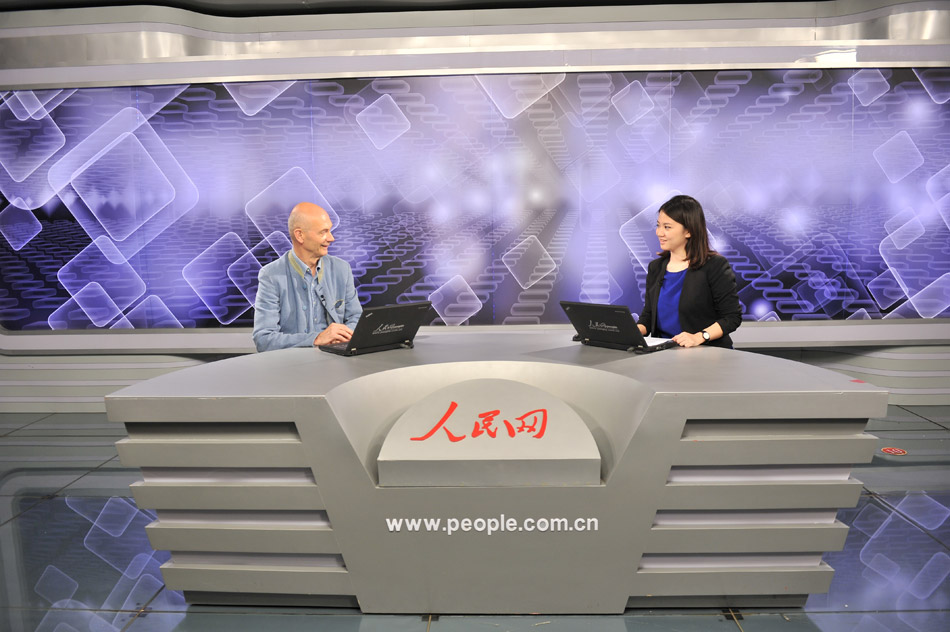 WTO Director General Pascal Lamy receives a video interview at People's Daily Online on June 29, 2013. (People's Daily Online/ Yu Kai)