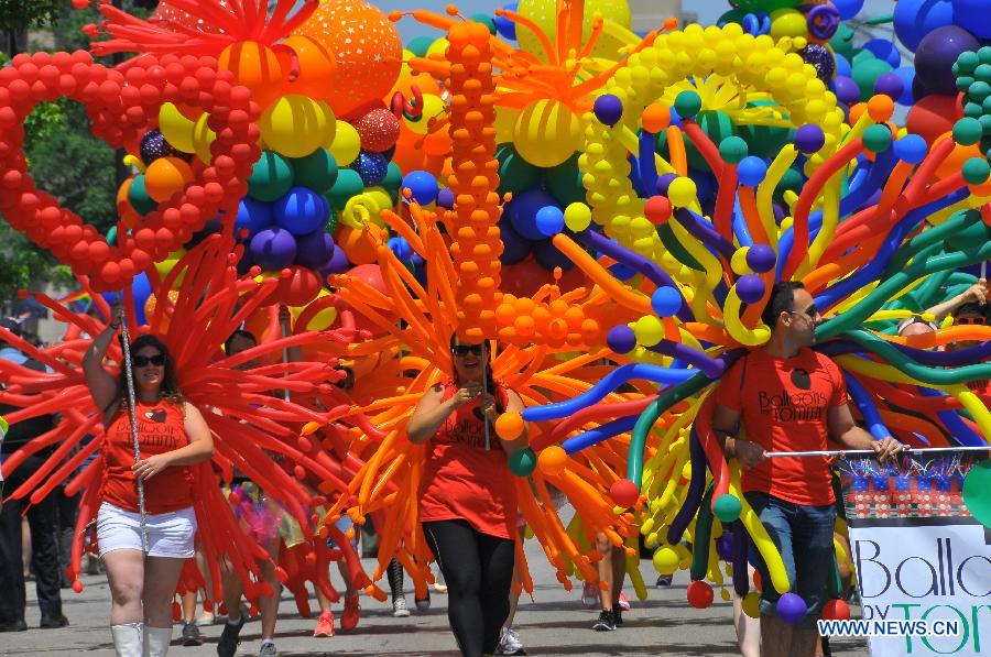 People participate in the annual Gay Pride Parade in Chicago, the United States, June 30, 2013. (Xinhua/Jiang Xintong) 