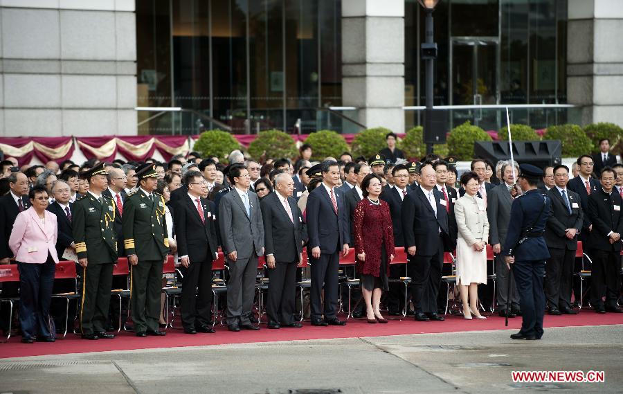 Tung Chee-hwa (6th L, front), vice chairman of the National Committee of the Chinese People's Political Consultative Conference (CPPCC), and Chief Executive of Hong Kong Special Administrative Region Leung Chun-ying (7th L, front) attend a flag-raising ceremony held to celebrate the 16th anniversary of Hong Kong's return to the motherland, in Hong Kong, south China, July 1, 2013. (Xinhua/Lui Siu Wai)