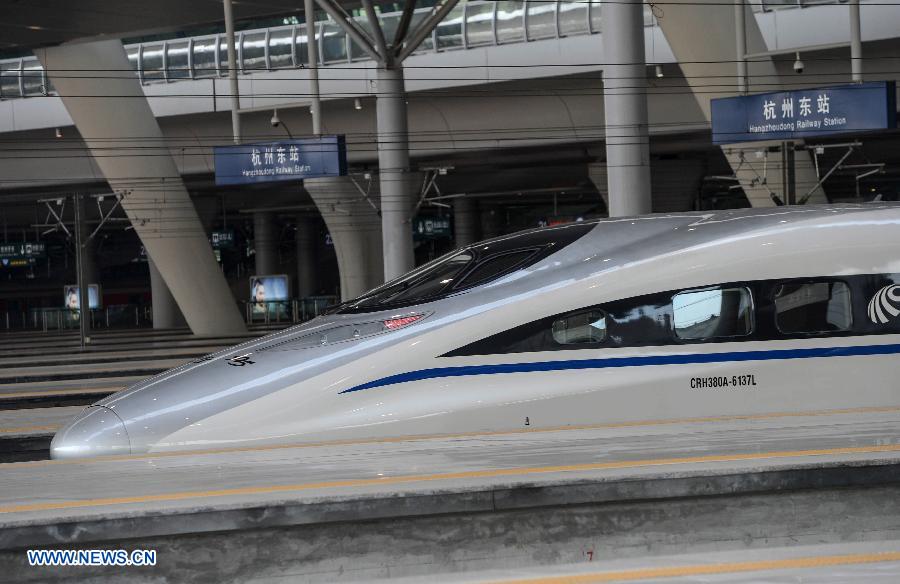 Photo taken on July 1, 2013 shows a high-speed train at the newly-opened Hangzhou East Station in Hangzhou, capital of east China's Zhejiang Province. With the building area of 1.13 million square meters, the Hangzhou East Station, China's largest railway terminal, officially opened on Monday. (Xinhua/Zhu Yinwei)