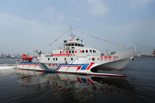 China's new fast rescue vessel Bei Hai Jiu 203 is put into action at Zhifu Island, Yantai, Shandong province, on July 1, 2013. Operated by Beihai Rescue Bureau, it will patrol the country's northern territorial waters. The vessel, which can carry 200 people on board, is fitted with equipment to enhance night rescues. (Photo/Xinhua)