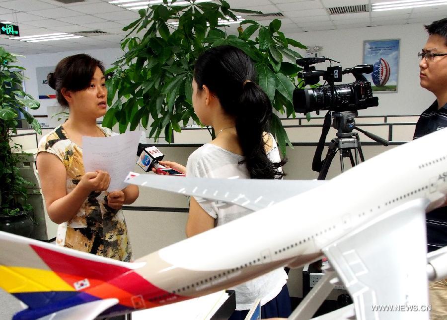 Employee of Asiana Airlines interviewed in Shanghai 