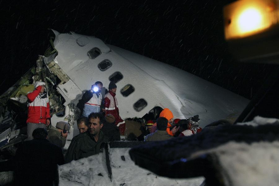 Rescuers work at the crash site of a passenger plane near the city of Uroumieh in northwest of Iran on Jan. 9, 2011. A passenger plane with over 100 passengers on board crashed in northwest Iran, with at least 35 passengers surviving and scores killed, the local English language satellite Press TV quoted an unnamed red crescent official as saying. (Xinhua/Mehr, Esfandiar Asgharkhani)