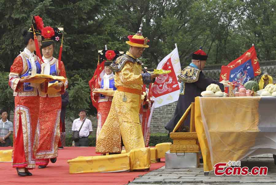 Aisin Gioro Hengshao, an offspring of the imperial family of Qing Dynasty (1644-1911), attends a ceremony in the costume of a Qing emperor to worship his ancestors at the World Heritage Yongling Tomb in Fushun, Liaoning Province, July 7, 2013. The ceremony was held to encourage the locals to protect the tomb and the fellow members of the Manchu minority group to treasure both the physical and spiritual cultural inheritance passed on from ancient times. (CNS/Cao Lichun)