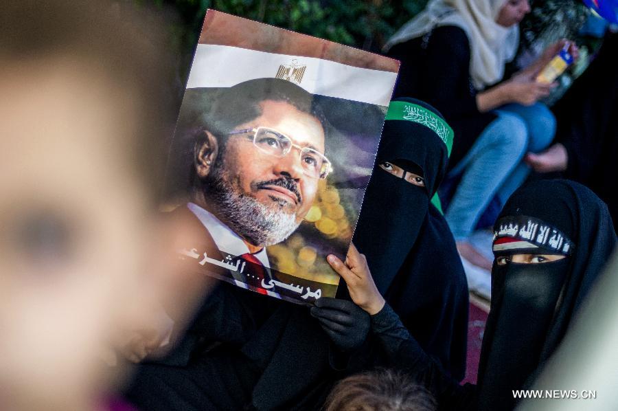 Egyptian security forces open fire at Morsi's supporters, 51 killed
