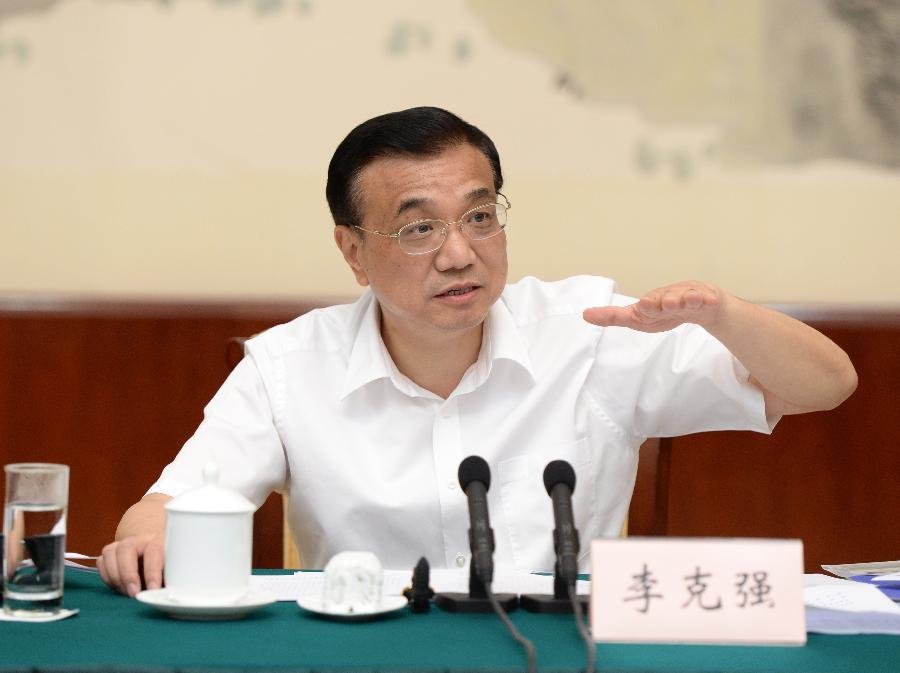 Chinese Premier Li Keqiang addresses a symposium on the economic situation of a number of provinces and regions in Nanning, capital of southwest China's Guangxi Zhuang Autonomous Region, July 9, 2013. (Xinhua/Ma Zhancheng)