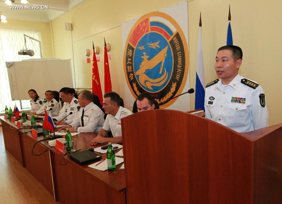 Commander of Chinese naval fleet Wang Dazhong addresses the closing ceremony of the joint naval drills in Vladivostok, Russia, July 11, 2013. Ding Yiping, deputy commander of the Chinese Navy and director of the "Joint Sea-2013" drill, announced the end of the joint naval drills here on Thursday. (Xinhua/Zha Chunming)