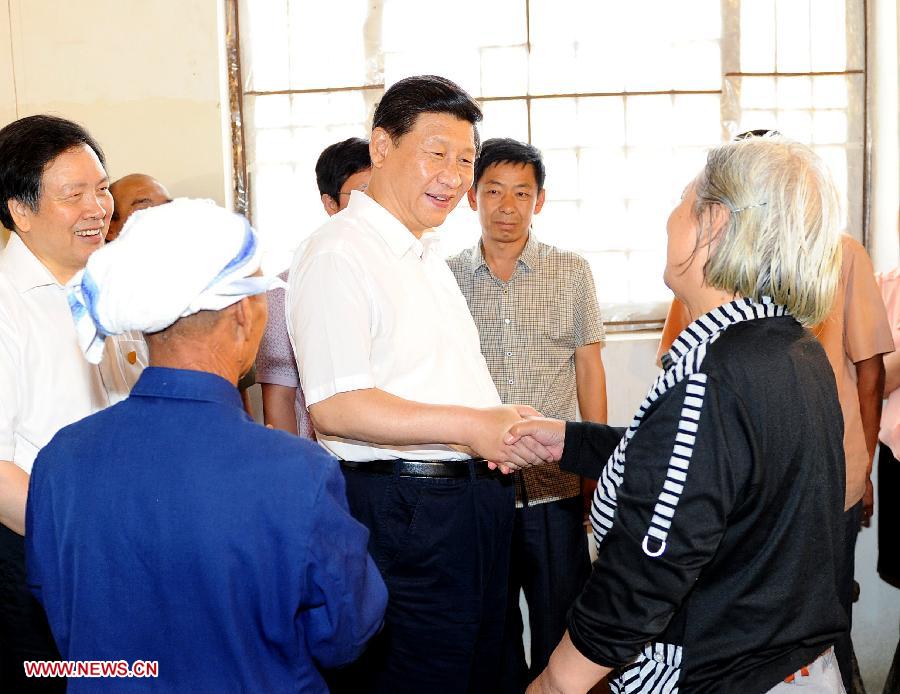 Chinese President Xi Jinping (C) talks with local citizens in Xibaipo, an old revolutionary base, in north China's Hebei Province. Xi made an inspection tour of Hebei Province from July 11 to 12. (Xinhua/Li Tao)