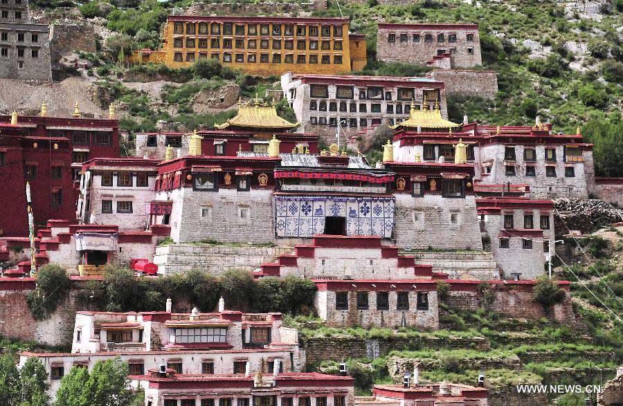 Photo taken on July 12, 2013 shows a view of the Gaden Monastery in Dagze County, southwest China's Tibet Autonomous Region. The Gaden Monastery, the first monastery of the Geluk school of Tibetan Buddhism, was set up in 1409. It was listed as one of the first batch of national key cultural relics protection units in 1961. (Xinhua/Liu Kun)