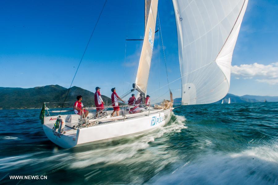 The crew of the "Loyal" vessel, champions of the C30 class, navigates on the last day of the South American Championship at the Rolex Ilhabela Sailing Week 2013 in Ilhabela, Brazil, on July 13, 2013. (Xinhua/Marcos Mendez)