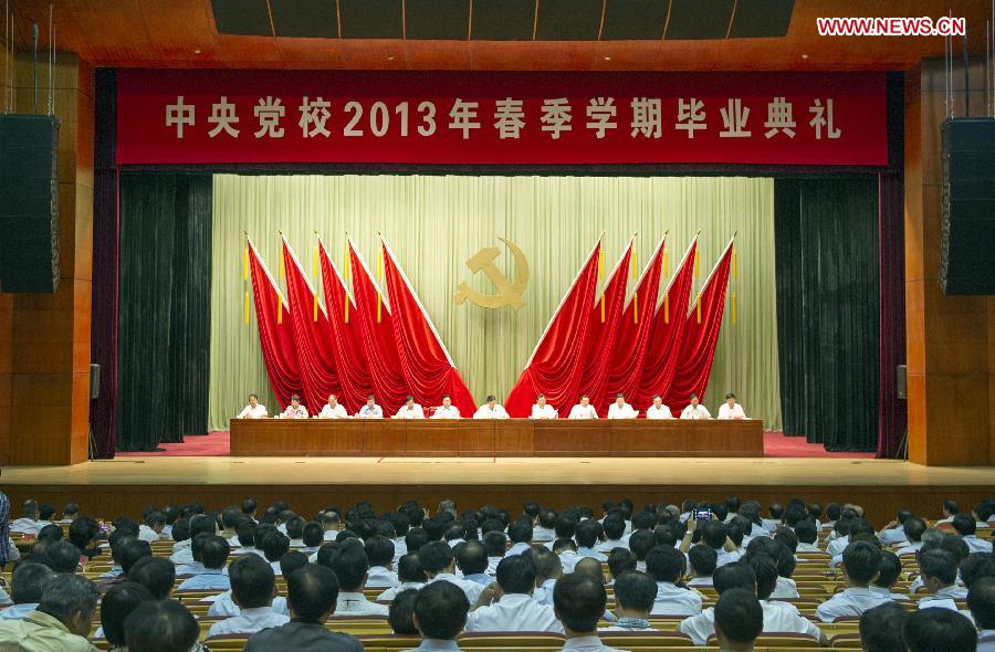 Liu Yunshan (C, back), a member of the Standing Committee of the Political Bureau of the Communist Party of China (CPC) Central Committee and president of the Party School of the CPC Central Committee, attends a graduation ceremony held by the Party School in Beijing, capital of China, July 15, 2013. Liu awarded diplomas to participants who have just completed their studies in the school's 2013 spring semester during the ceremony on Monday. (Xinhua/Xie Huanchi)