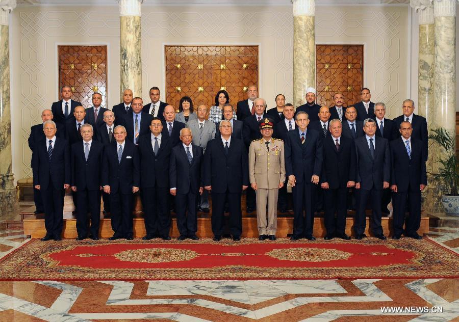 In this hand out picture released by the Egyptian presidency shows Egypt's interim president Adly Mansour (front C) and the newly sworn-in Egypt's interim cabinet pose for a group picture on July 16, 2013 in Cairo. Egypt's interim government, headed by Prime Minister Hazem Beblawi, was sworn in on Tuesday, with no one from Islamic parties included in the interim cabinet. (Xinhua/Egyptian Presidency)