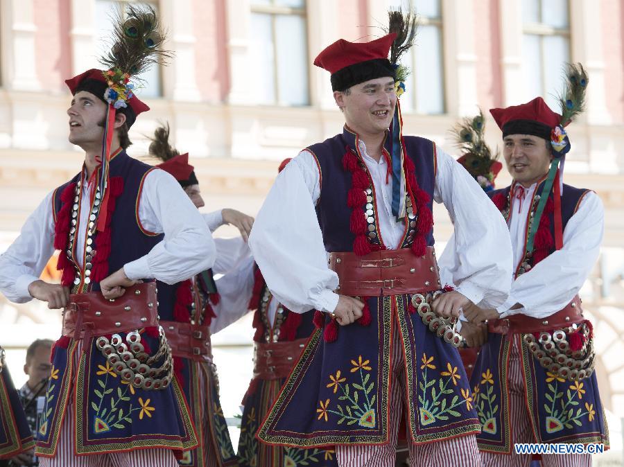 Participants from Poland perform during the 47th International Folklore Festival in Zagreb, capital of Croatia, on July 18, 2013. Around 900 participants of 29 art groups from Croatia and 11 other countries and regions took part in the five-day traditional festival. (Xinhua/Miso Lisanin) 